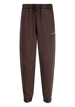 MONOCHROME logo-embossed cotton track pants - Brown