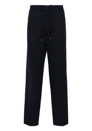 Brunello Cucinelli pressed-crease loose-fit trousers - Blue