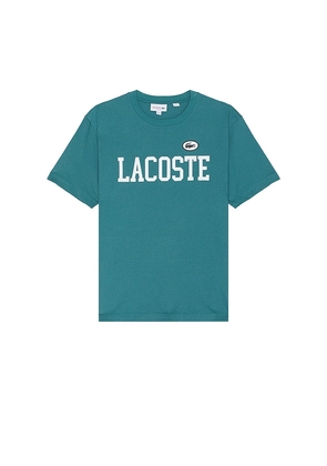 Lacoste Large Classic Fit Tee in Teal. Size 4, 5, 6.