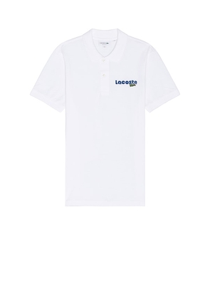 Lacoste Regular Fit Polo in White. Size 4, 5, 6.