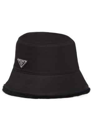 Prada triangle-logo shearling bucket hat - Black