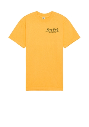 Sporty & Rich Ny 94 T-shirt in Faded Gold - Orange. Size L (also in M, S, XL/1X).