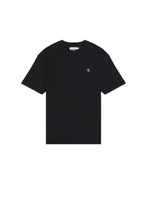 Calvin Klein Short Sleeve Relaxed Archive Logo Tee in Black. Size M, S, XL/1X, XS.