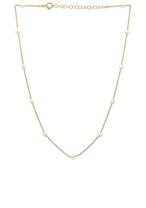 Joy Dravecky Jewelry The Looker Pearl Necklace in Metallic Gold.