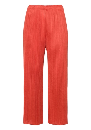 Pleats Please Issey Miyake pleated cropped trousers - Red