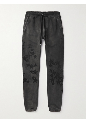 AMIRI - Pigment Spray Star Tapered Leather-Trimmed Cotton-Jersey Sweatpants - Men - Black - XS