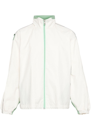 Robyn Lynch piping-detailed zip-up jacket - White