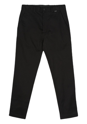 Calvin Klein logo-tag tapered-leg trousers - Black