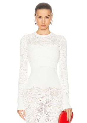 ALAÏA Long Sleeve Cropped Top in Blanc - White. Size 34 (also in 38, 40).