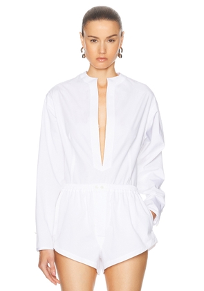 ALAÏA Long Sleeve Bodysuit in Blanc - White. Size 36 (also in 34, 38).