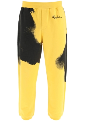 Moschino graphic print jogger pants with logo - 48 Yellow