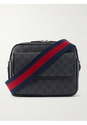 Gucci - Small Leather-Trimmed Monogrammed Coated-Canvas Messenger Bag - Men - Black