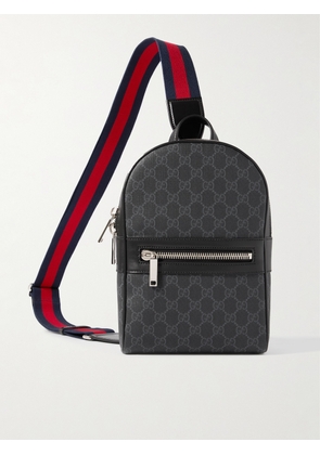 Gucci - Leather-Trimmed Monogrammed Coated-Canvas Sling Backpack - Men - Black