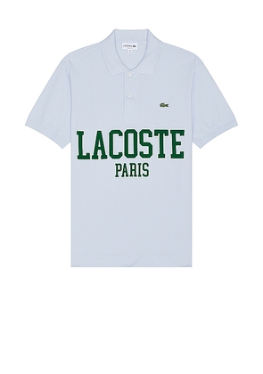 Lacoste Classic Fit Polo in Baby Blue. Size 4, 5, 6.