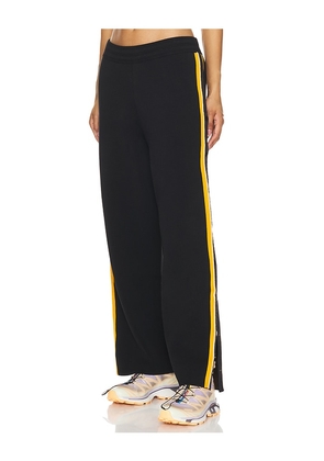 Nagnata Side Snap Track Pant in Black. Size M, S, XS.