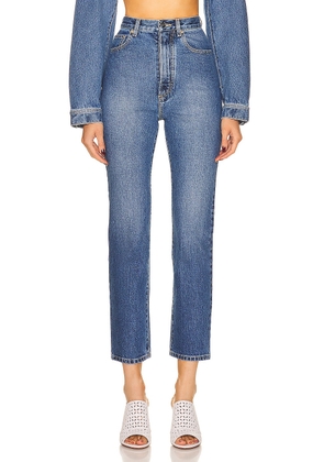ALAÏA High Waisted Jean in Blue Jean - Blue. Size 40 (also in ).