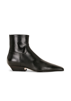 KHAITE Marfa Classic Flat Ankle Boot in Black - Black. Size 37.5 (also in ).