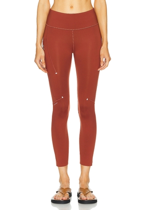 On Performance 7/8 Tight in Ruby - Rust. Size XS (also in ).
