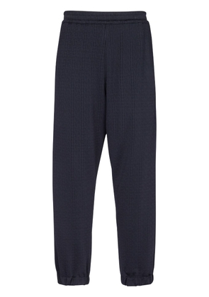 Balmain monogram-pattern elasticated-waistband track pants - Blue