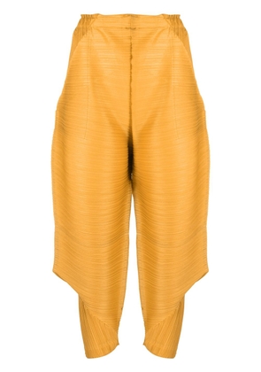Pleats Please Issey Miyake cropped pleated trousers - Yellow