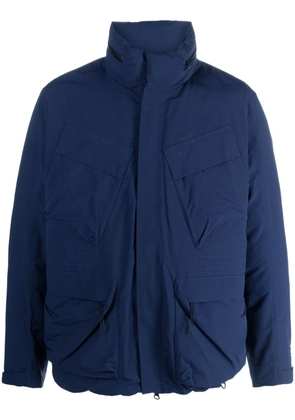 C.P. Company logo-print cargo-pocket jacket - Blue