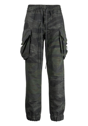 Mostly Heard Rarely Seen camouflage-pattern panelled cargo trousers - Green