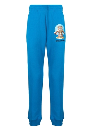 Moschino logo-print cotton track pants - Blue