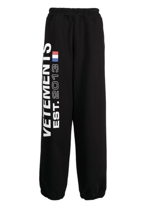 VETEMENTS Flag-logo print track pants - Black