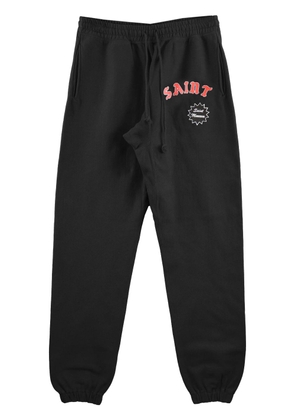 SAINT MXXXXXX logo-print cotton track pants - Black