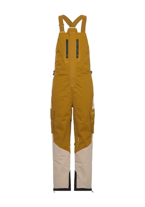 Whitespace 2L Cargo Insulated Bib Pant in mustard. Size M, S, XL/1X.