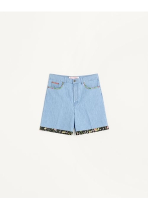 Valentino DENIM BERMUDA SHORTS WITH FLORAL PRINT HEM Man DENIM 30