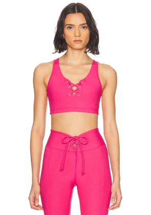 YEAR OF OURS Ribbed Football Sports Bra in Magenta - Pink. Size L (also in M, S, XS).