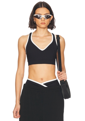 YEAR OF OURS Ribbed V Neck Sports Bra in Black & White - Black. Size S (also in XS).