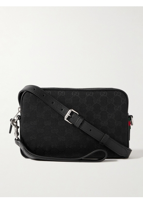 Gucci - Leather-Trimmed Monogrammed Canvas Small Crossbody Bag - Men - Black