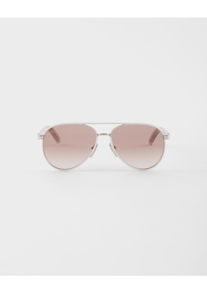 Prada sunglasses with the iconic metal plaque