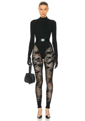 ALAÏA Turtleneck Catsuit in Noir - Black. Size 36 (also in ).