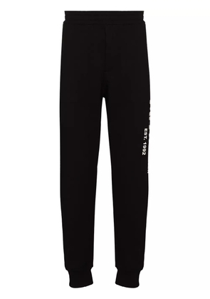 Alexander McQueen logo graffiti print track pants - Black