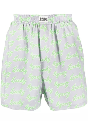 Natasha Zinko all-over slogan-print cotton shorts - Grey