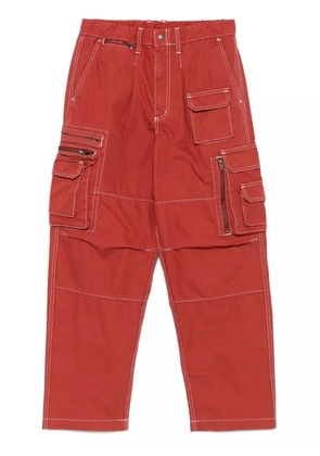 This Is Never That Crazy multi-zip cargo trousers - Red