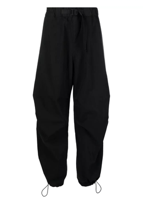 Studio Nicholson Caro belted wide-leg trousers - Black