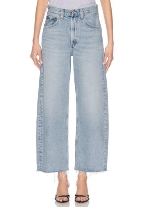 AGOLDE Low Curve Fray Jeans in Force - Blue. Size 25 (also in 26, 27, 28, 29, 30, 32, 34).