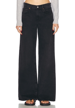 AGOLDE Clara Low Rise Baggy Flare Jeans in Mascara - Black. Size 27 (also in 30, 32, 34).