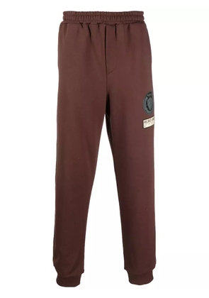 Helmut Lang logo-patch tapered joggers - Brown
