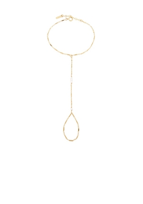 Natalie B Jewelry Yaya Hand Chain in Metallic Gold.