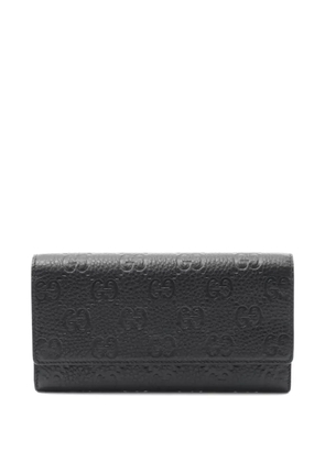 Gucci Pre-Owned 2020s GG emblem bi-fold wallet - Black