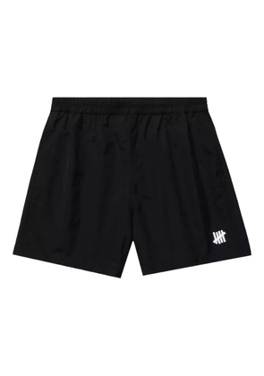 Undefeated logo-plaque swim shorts - Black