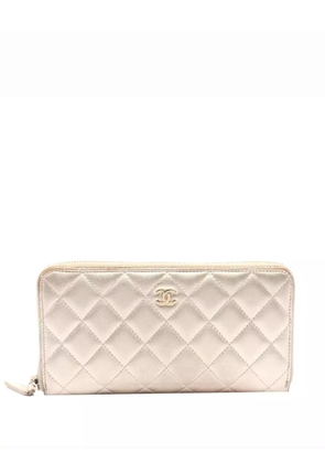 CHANEL Pre-Owned 2014 CC Quilted Metallic Lambskin Zip Around Wallet long wallets - Gold