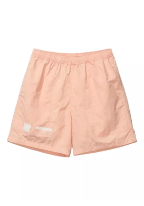 Undefeated logo-print tie-dye shorts - Orange