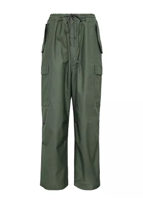 Junya Watanabe MAN cargo-pocket urethane trousers - Green