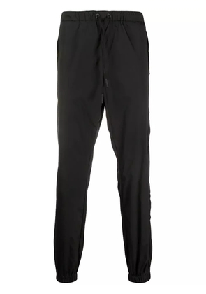 COUNTY OF MILAN Cross tapered track pants - Black